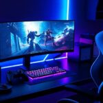 Best gaming accessories 2025 including high-performance headset, customizable controller, mechanical keyboard, gaming monitor, and ergonomic chair with neon blue and purple lighting.